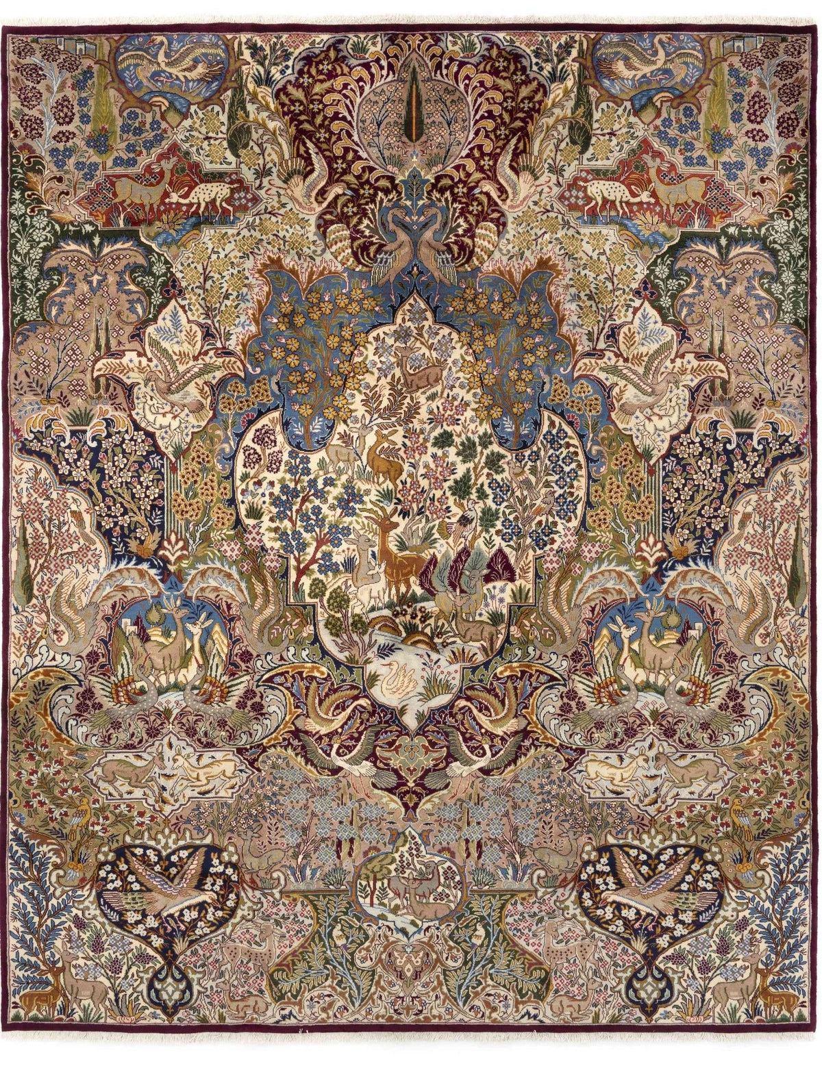 Hand-knotted rug with an intricate floral and animal motif, featuring birds, deer and foliage in rich blue, burgundy, cream and green tones.