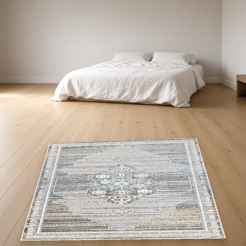 Platinum Center Medallion Modern Area Rug in a bedroom