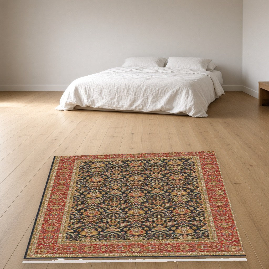 Navy Herati Heritage Rug in a bedroom