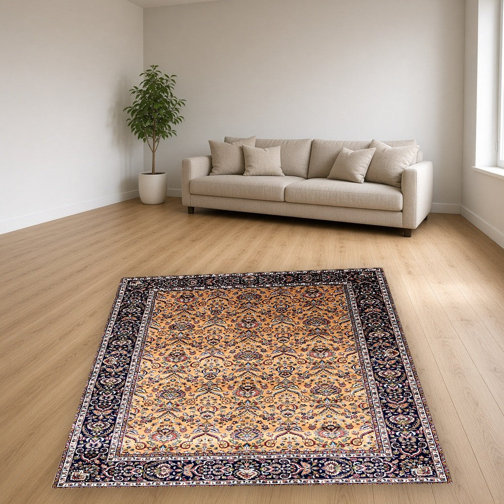 Gold Navy Garden Border Floral Mogul Area Rug in a living room