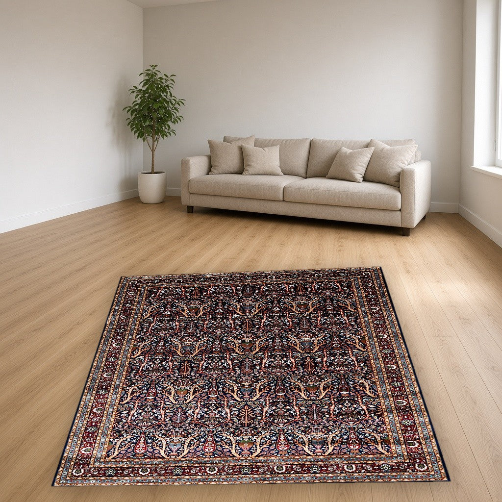Navy Dense Floral Palace Mogul Area Rug in a living room