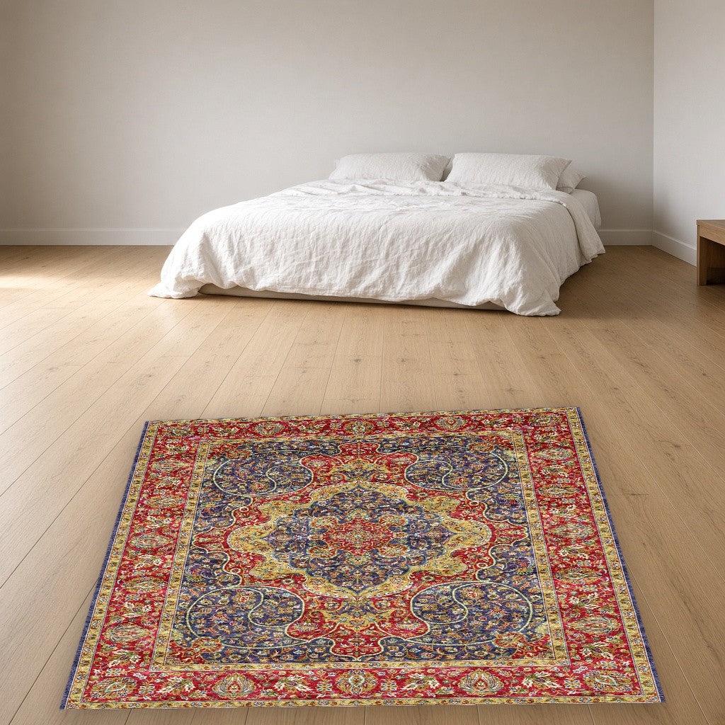 Navy Red Jewel Tone Floral Mogul Area Rug in a bedroom