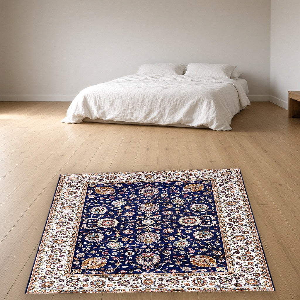 Navy White Classic Herati Field Mogul Area Rug in a bedroom