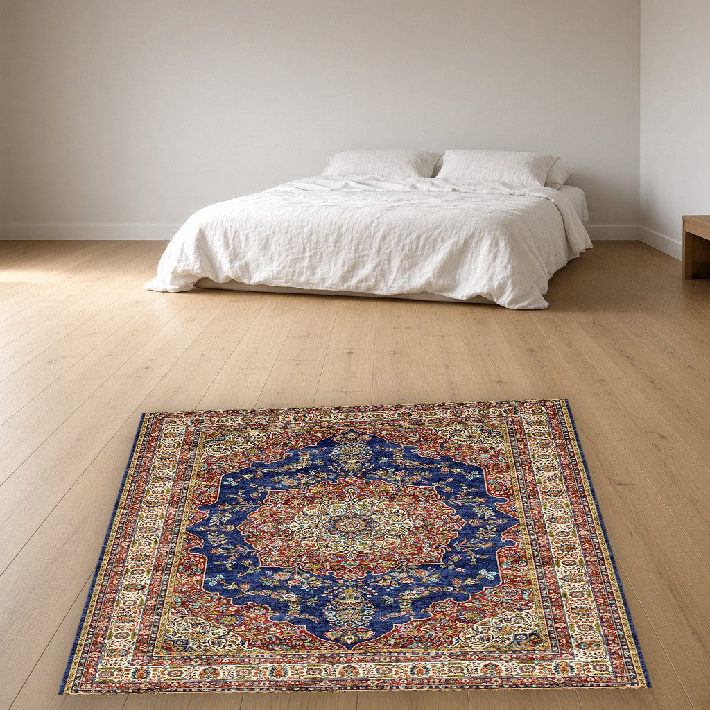Navy White Grand Medallion Mogul Area Rug in a bedroom