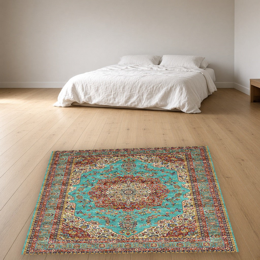 Turquoise Grand Medallion Mogul Area Rug in a bedroom