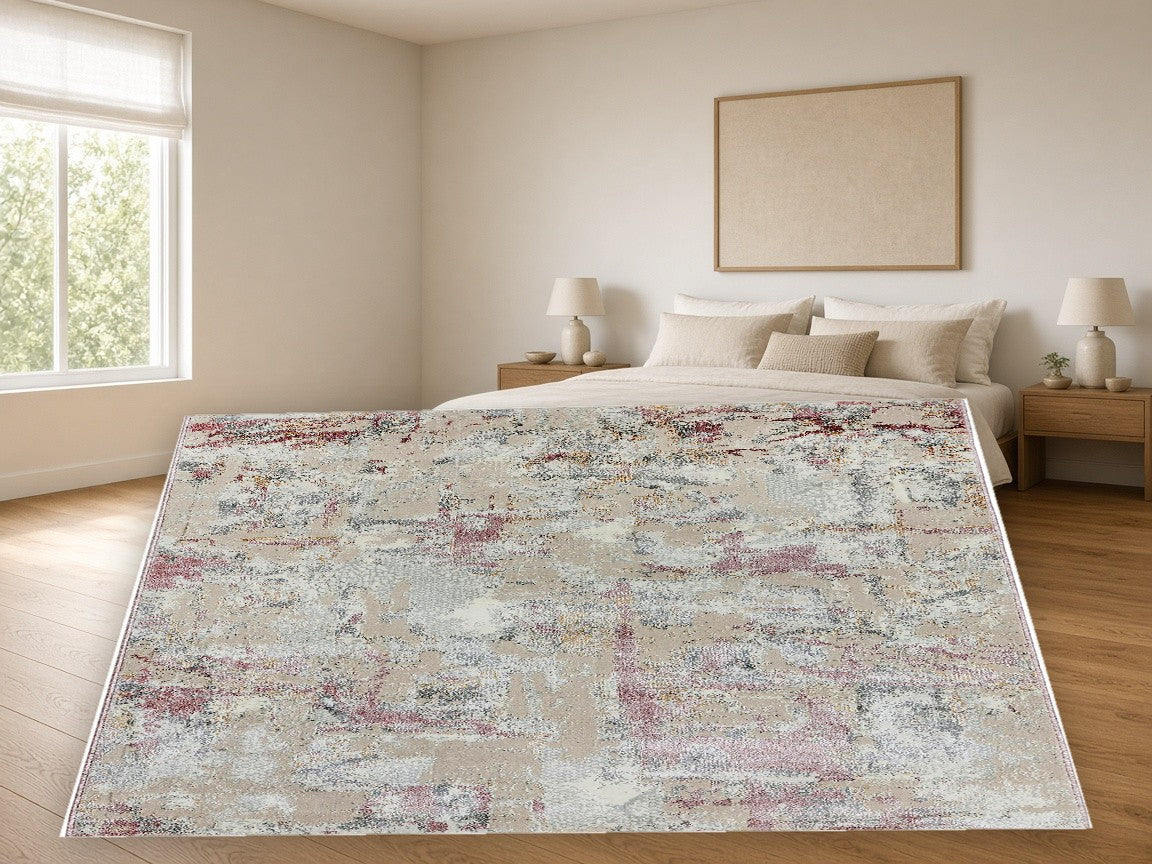 Dusty Rose Wash Abstract Area Rug in a bedroom