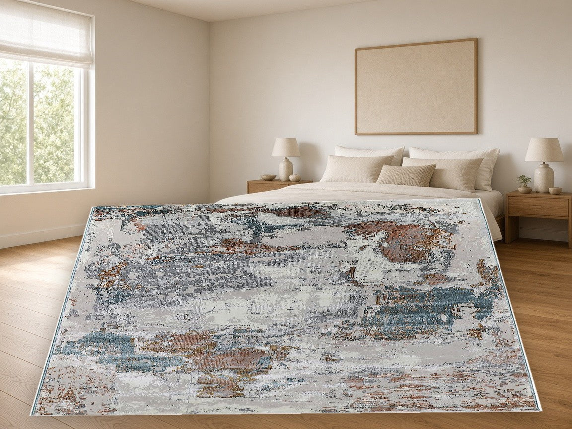 Indigo Patch Abstract Area Rug in a bedroom