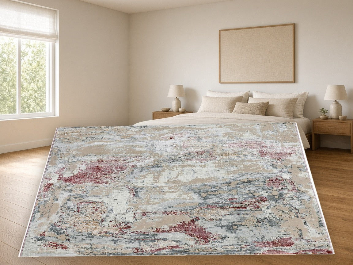 Rose Charcoal Splash Abstract Area Rug in a bedroom