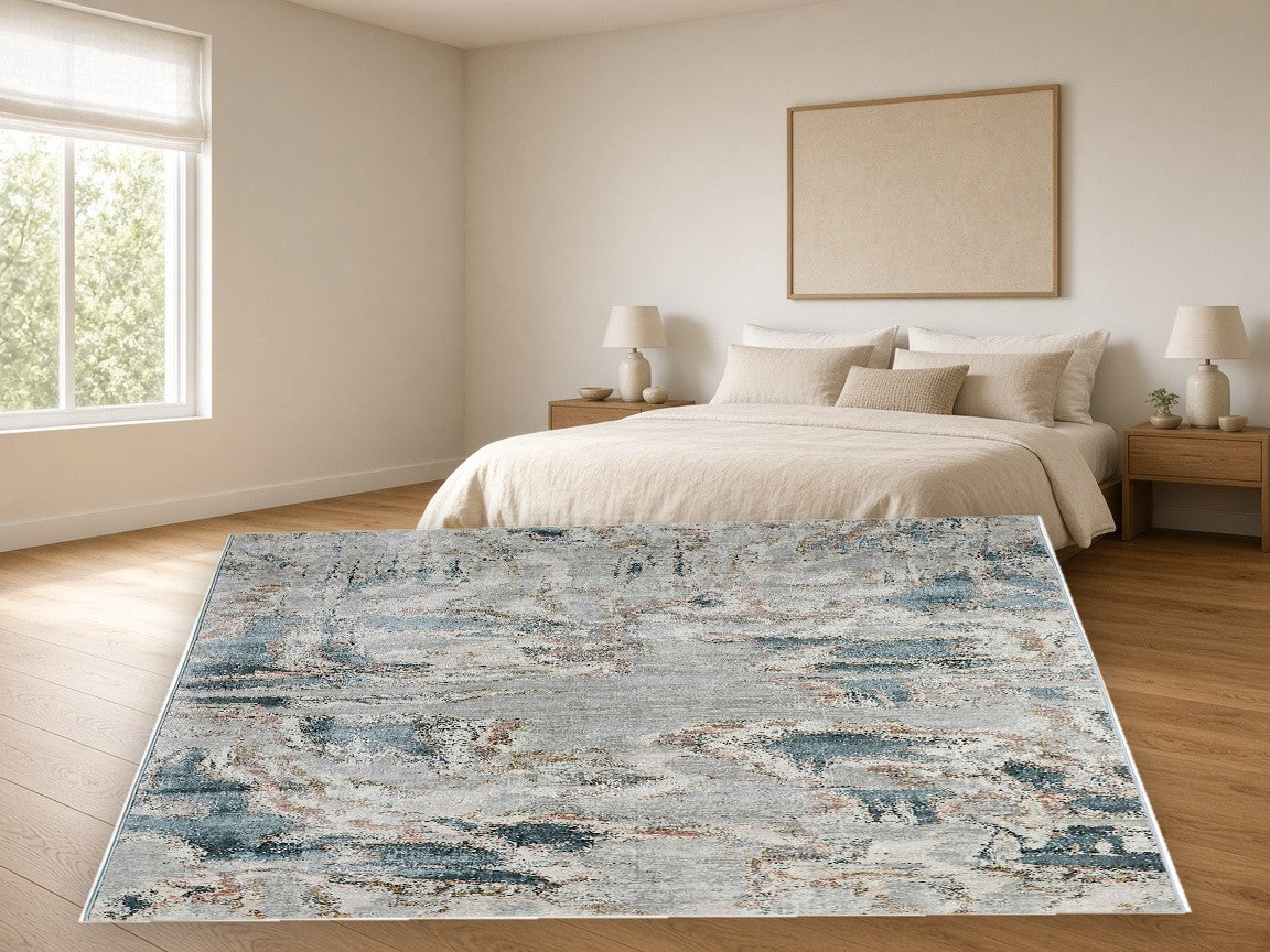 Slate Blue Cloud Abstract Area Rug in a bedroom